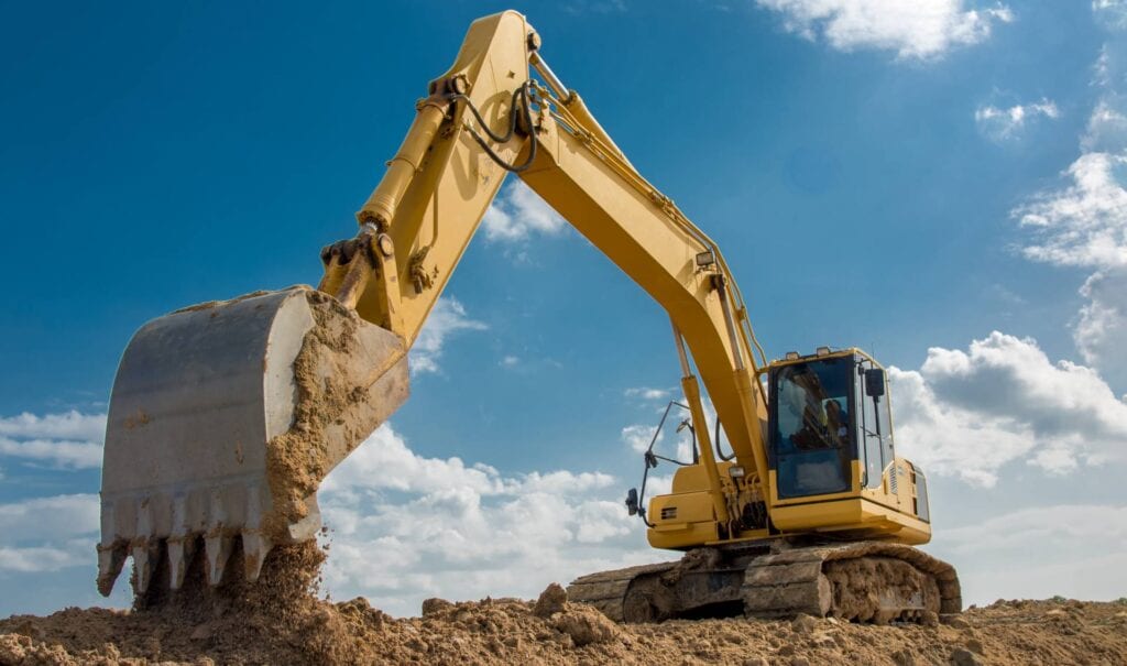 Yellow excavator operating on a sunny day